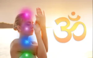 Woman meditating with chakras glowing